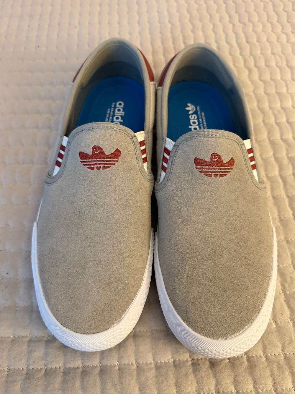 adidas Slip-On Suede Sneakers in Light Gray with Red Accents